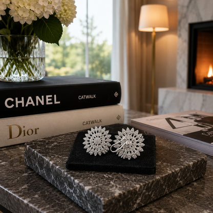 Back view of silver floral crystal leverback earrings showcasing the secure leverback latch closure on a premium black velvet display.