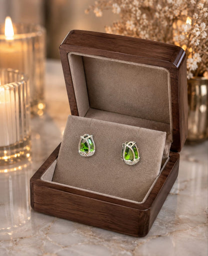 Tulip  green crystal stud earrings displayed in a premium velvet jewellery box with luxury wooden finish, candlelight ambience and dried floral décor