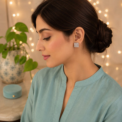 Model wearing Lumière Mosaic square silver pavé crystal stud earrings featuring a sparkling geometric design by TIAS Collection.