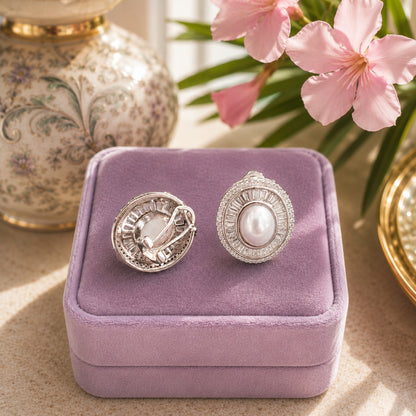 Back view of silver oval pearl statement stud earrings showing the secure clip-on comfort closure and detailed craftsmanship.