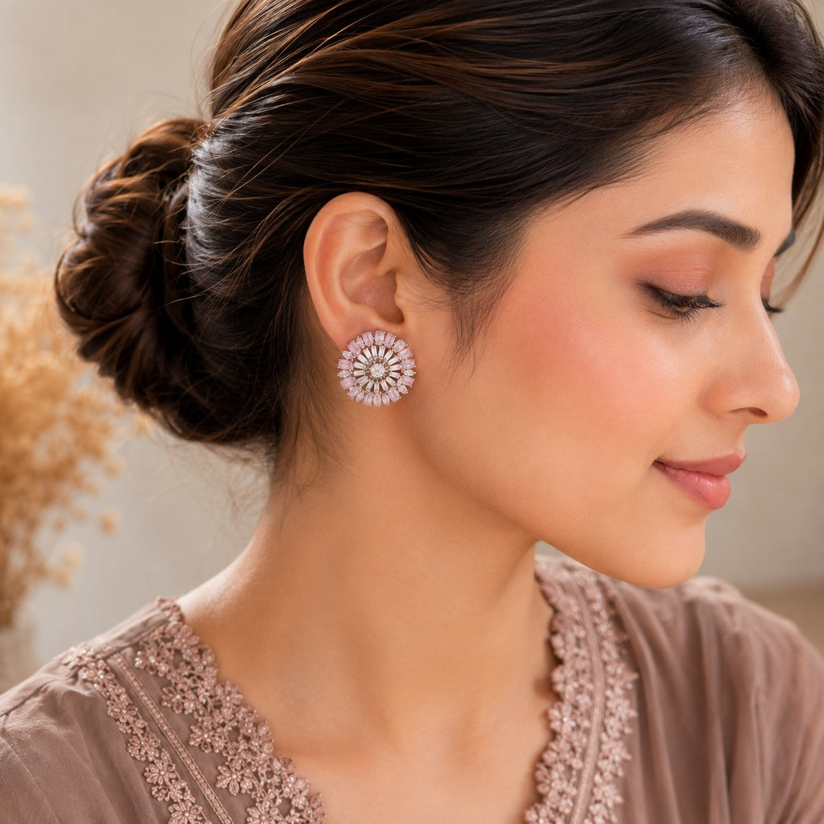 Close-up side profile highlighting rosé floral crystal stud earrings with blush pink stones and radiant circular detailing.
