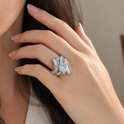 S925 sterling silver statement ring worn on the finger, featuring a sparkling round center stone and layered baguette zircon detailing.