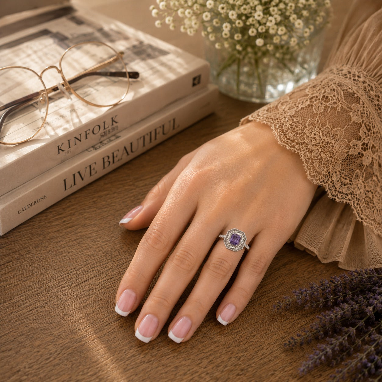 Model wearing an S925 sterling silver octagonal halo ring featuring the colored center stone variant with a slim polished band, styled in a warm editorial lifestyle setting.