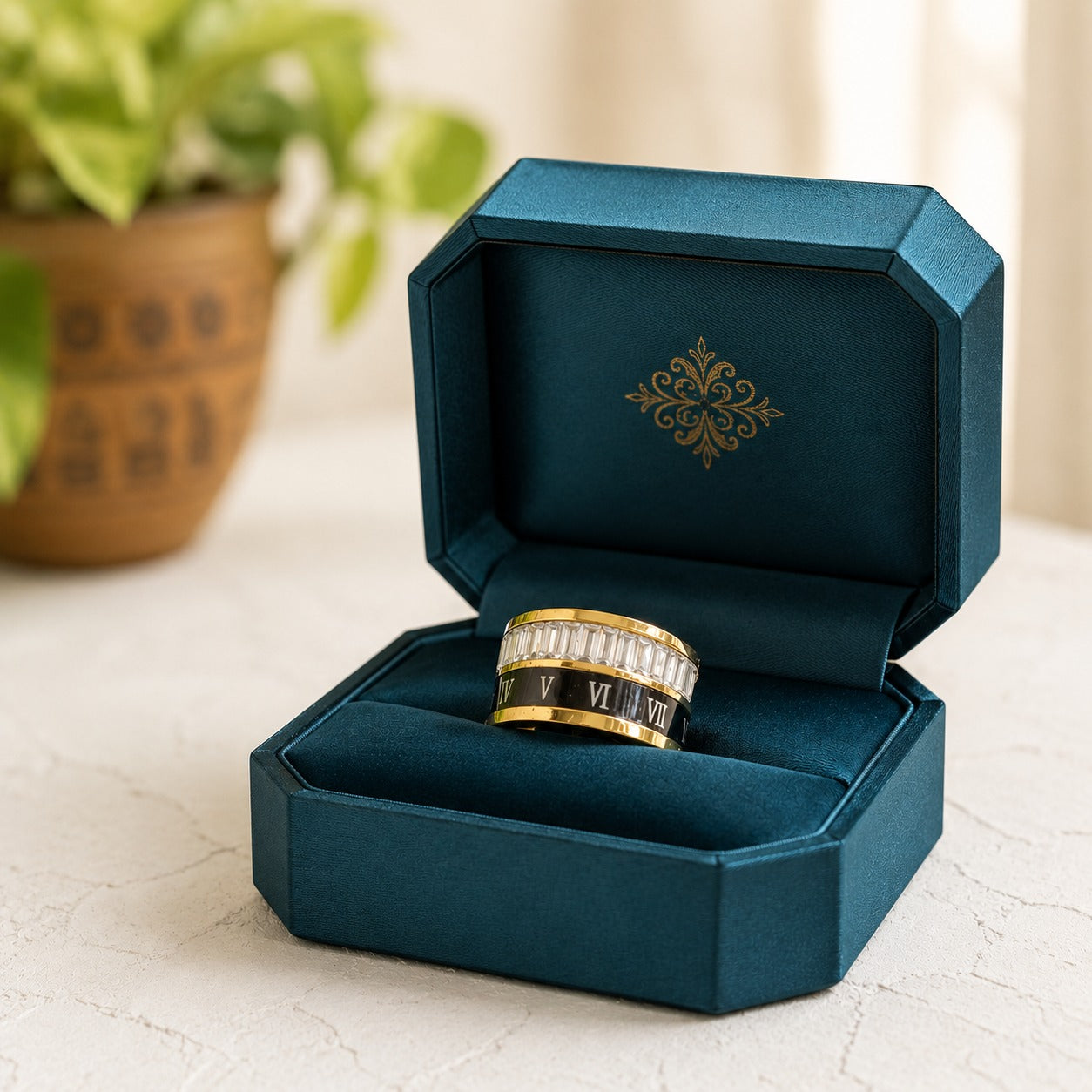 Heavy stainless steel Roman numeral band ring presented inside a premium deep teal luxury ring box highlighting its polished finish and crystal accents