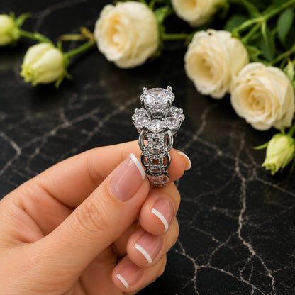 Side profile of the silver statement ring highlighting its intricate openwork band and crystal detailing.