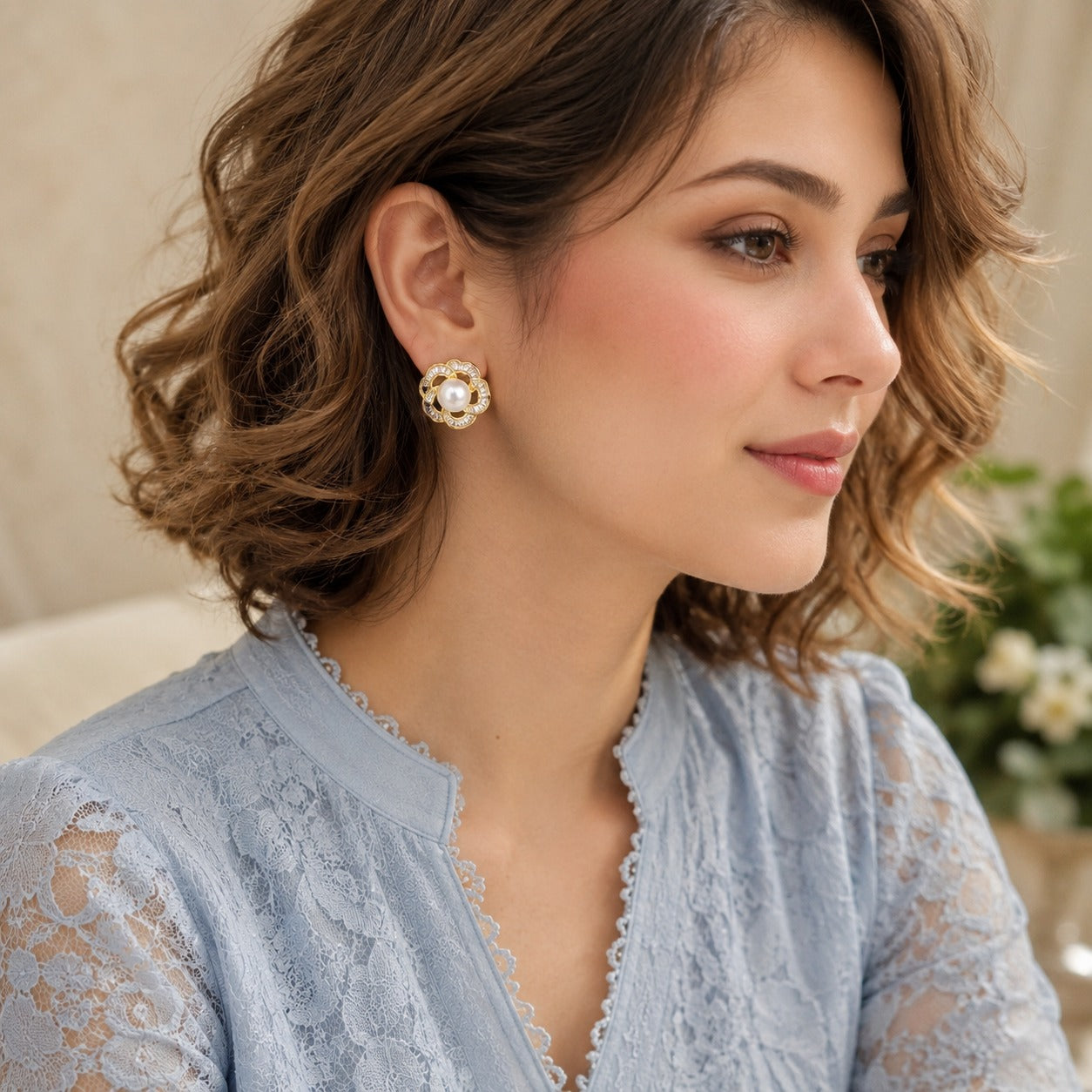 Silver Pearl Loop Stud Earrings styled on model with soft blue outfit