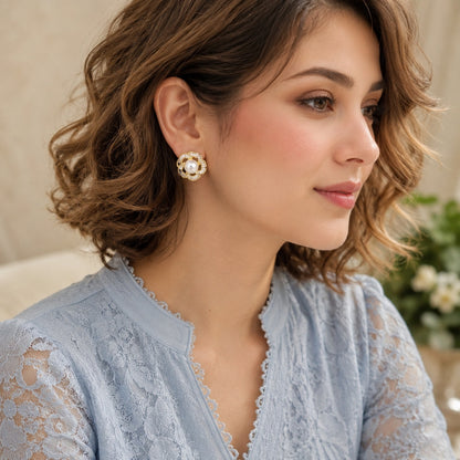 Silver Pearl Loop Stud Earrings styled on model with soft blue outfit