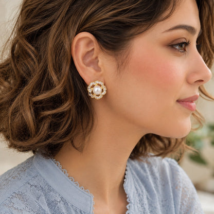 Silver Pearl Loop Stud Earrings styled on model with soft blue outfit