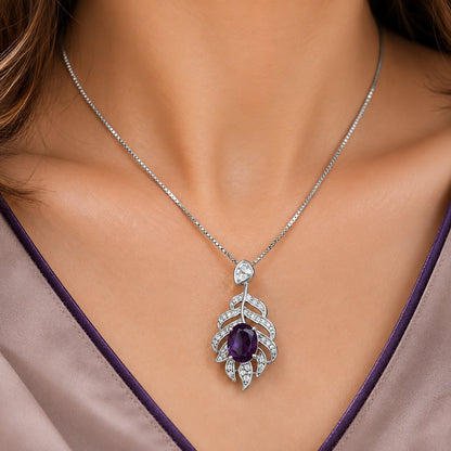 Close-up of model wearing the Deep Purple Plume Arc Pendant with an oval purple centre stone and clear zircon detailing