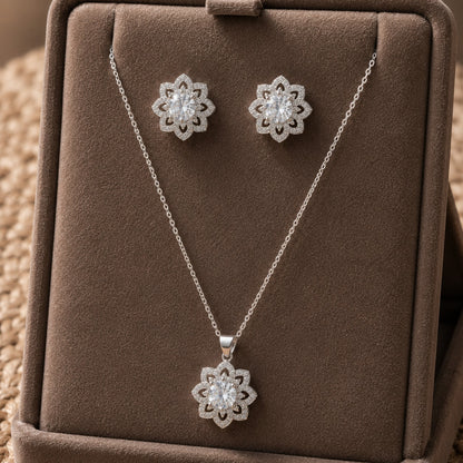 Solenne clear zircon pendant and matching stud earrings displayed on a taupe jewellery stand.