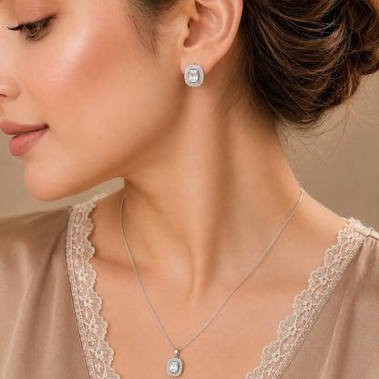  Close up of a model wearing Lucent Frame silver-tone clear zircon pendant necklace and matching rectangular stud earrings.