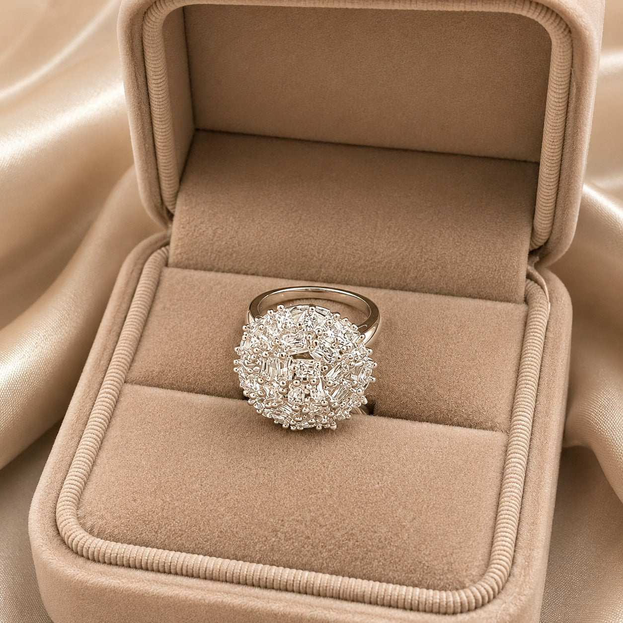 Prism Nest S925 silver ring displayed in a beige jewellery box, showing its raised round cluster and polished silver band.