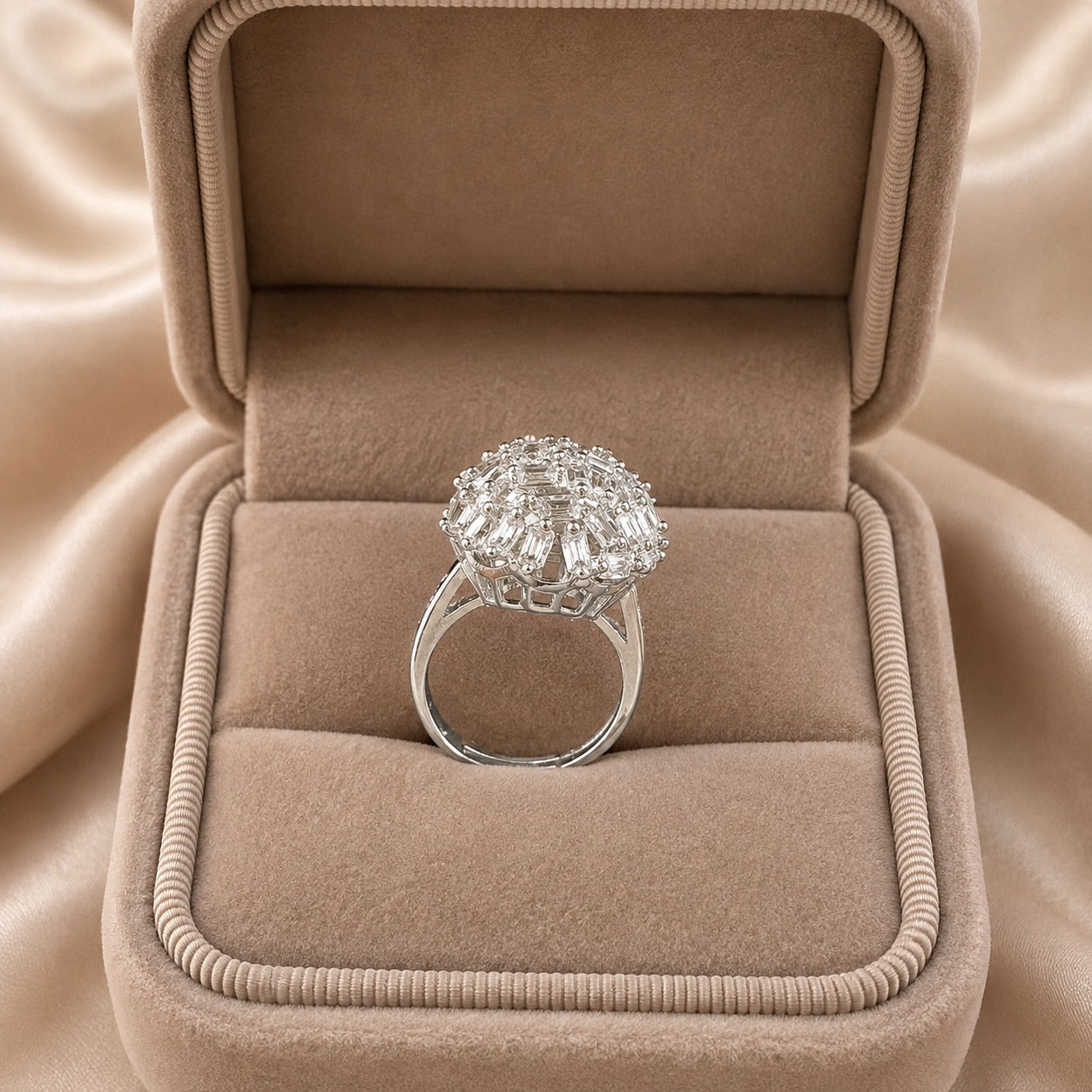 Prism Nest S925 silver ring displayed in a beige jewellery box, showing its raised round cluster and polished silver band.