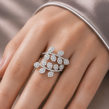 Close-up of Branchline S925 silver ring worn on hand, featuring two curved branches with clear zircon leaf motifs.