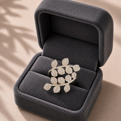 Branchline S925 silver ring with clear zircon pavé leaves displayed in a charcoal grey jewellery box.