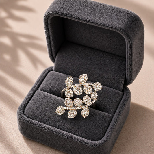 Branchline S925 silver ring with clear zircon pavé leaves displayed in a charcoal grey jewellery box.