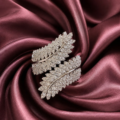 Virelle Leaf Ring in silver tone featuring two sweeping leaf forms embellished with clear zircon stones and polished curved stems