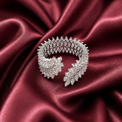 Angled view of the Vela Wrap Band showing its wide multi-row construction, open ends and intricate marquise stone setting.