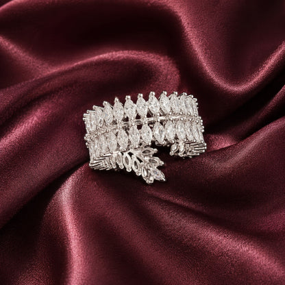 Back close-up of S925 silver statement band with overlapping marquise clear stones displayed on deep burgundy satin.