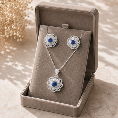 S925 Rosette Prism earrings and pendant set with sapphire blue centre stone displayed in a premium jewellery box