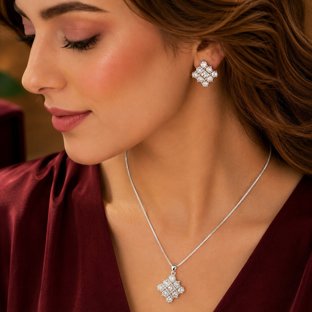 Model wearing S925 silver geometric clear stone earrings with matching pendant necklace.