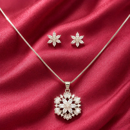 S925 Petal Array pendant and matching stud earrings with clear marquise and tapered stones displayed on crimson fabric.