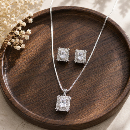 Veyra S925 silver earrings and pendant set with rectangular clear zircons, pavé detailing and baguette-cut corner accents.