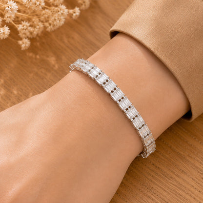  close up of Prism Line Bracelet worn on the wrist, featuring clear rectangular baguette stones in a polished silver-tone setting.