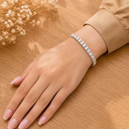 Prism Line Bracelet worn on the wrist, featuring clear rectangular baguette stones in a polished silver-tone setting.