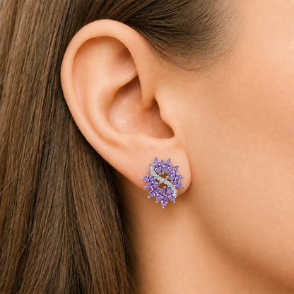 Close-up of Violet Arc S925 purple stud earring worn on the ear, featuring faceted marquise stones and a curved clear zircon accent.