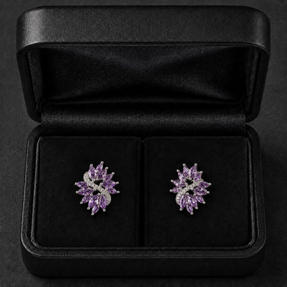 S925 Violet Arc Stud Earrings in the  purple variant, featuring marquise-cut clear stones and tiny zircon detailing in a black jewellery box
