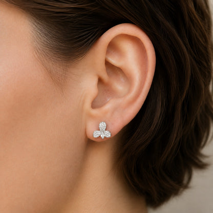 Close-up of S925 Tria Glint Stud Earring worn on the ear, showing three pavé zircon sections surrounding a clear marquise-cut centre stone.