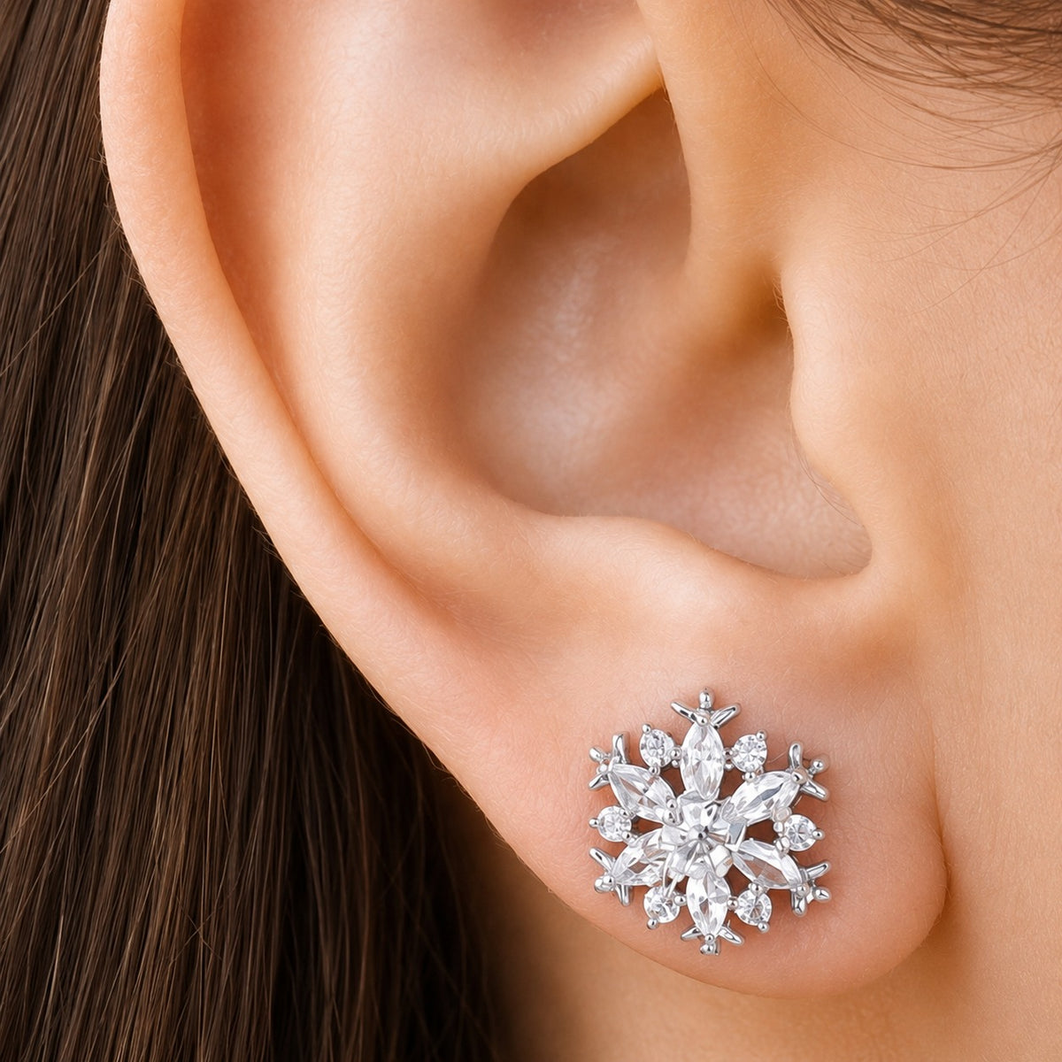 Close-up of Frostwork S925 silver zircon stud earring worn on the ear, showing its compact size and intricate sparkling design.