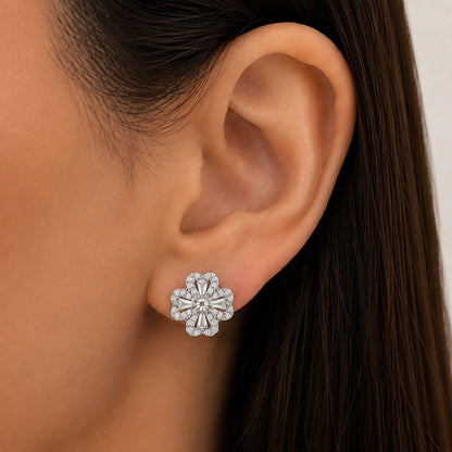 Close-up of a model wearing an S925 silver Prism Clover Stud, showing the compact four-petal design and sparkling clear zircon details on the ear.