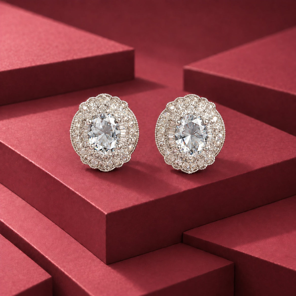 Verdanza Oval statement stud earrings with a faceted oval clear centre stone and detailed clear zircon surround in a polished silver-tone setting
