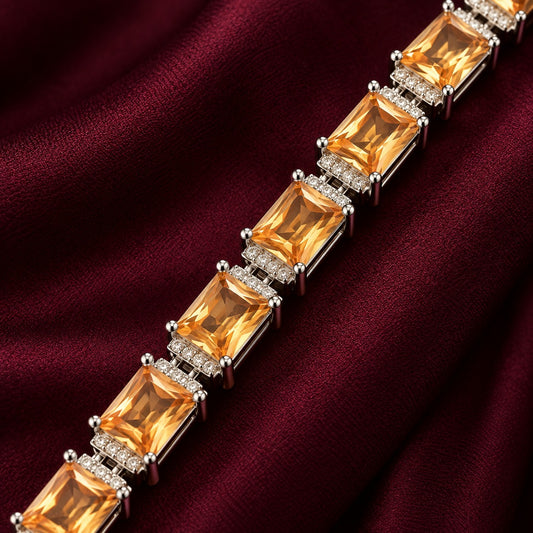Champagne Gallery Link Bracelet with rectangular champagne stones and clear zircon separators displayed on deep burgundy fabric