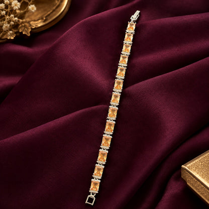 Champagne Gallery Link Bracelet with rectangular champagne stones and clear zircon separators displayed on deep burgundy fabric.