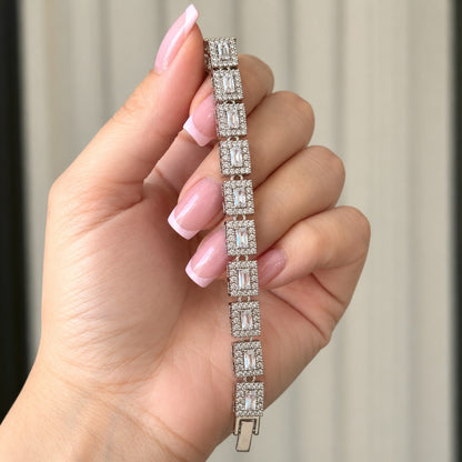 Detailed view of the silver-tone Framed Link Bracelet showing its articulated rectangular settings and polished box-style clasp.