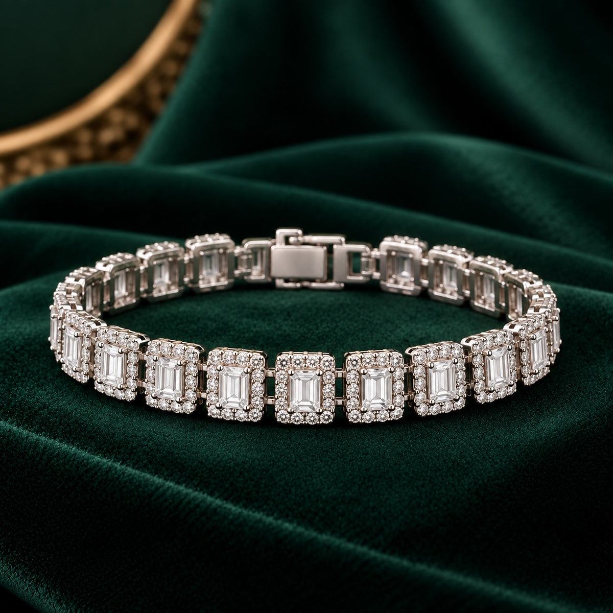 Closed silver-tone Framed Link Bracelet displayed on dark green velvet, showing a continuous row of rectangular clear stones surrounded by zircon.
