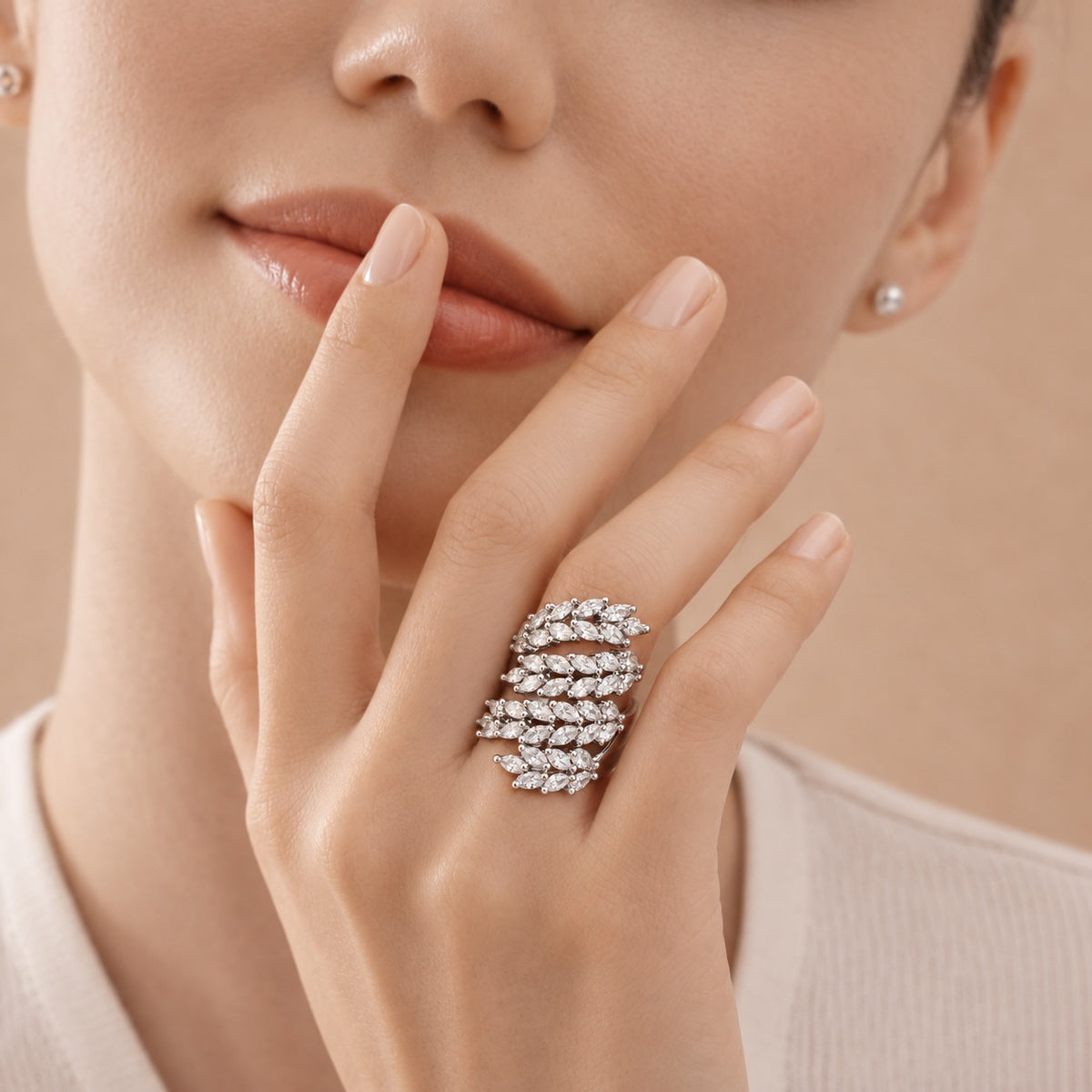 Silver Laurel Statement Ring worn on the finger, showing its broad multi-row arrangement of marquise-cut clear zircon and polished sterling silver setting