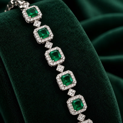 Silver-tone Regal Grid Bracelet featuring square-cut gemstones surrounded by clear zircon borders and connected with small diamond-shaped zircon links, available in ruby red, emerald green and clear zircon.