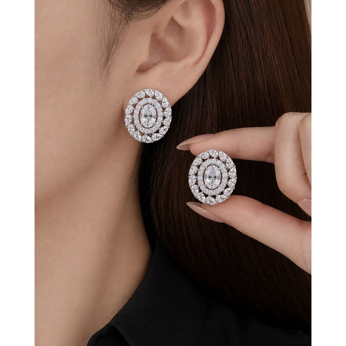 Close-up of Regal Wreath Stud worn on the ear, showing its statement oval shape and layered clear zircon wreath design.