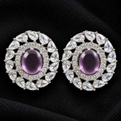 Detailed close-up of Regal Wreath Studs showing the purple oval centre stone, inner zircon border and outer ring of pear-cut clear stones.