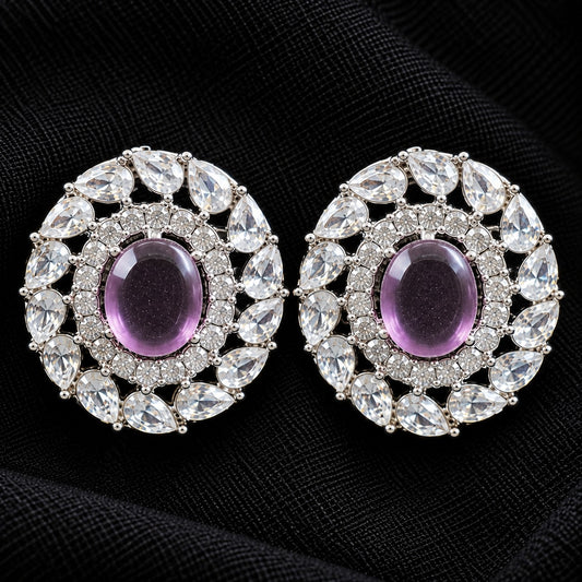 Detailed close-up of Regal Wreath Studs showing the purple oval centre stone, inner zircon border and outer ring of pear-cut clear stones.