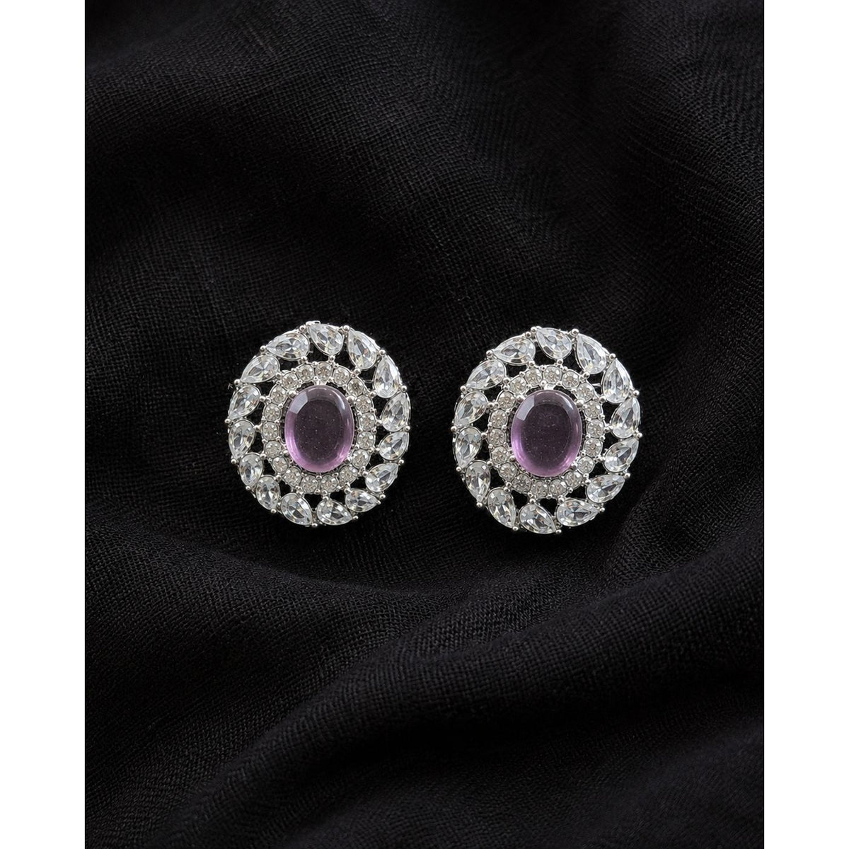 Regal Wreath Studs in silver-tone metal featuring an oval  purple centre stone surrounded by clear zircon and a wreath of pear-cut stones.