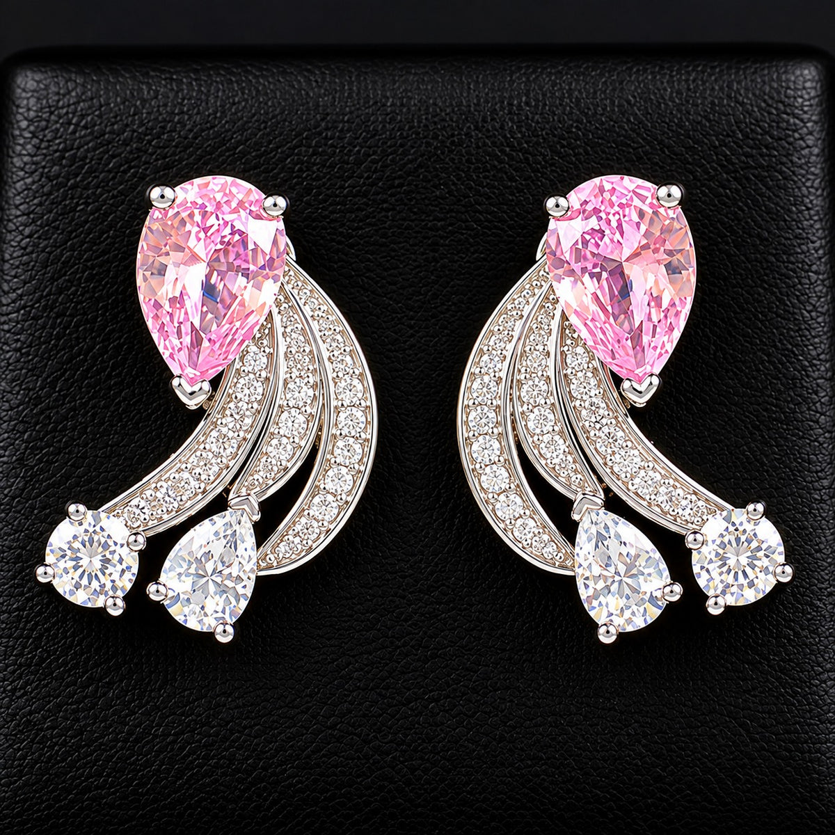 Pair of Angelique Wing Studs in silver-tone metal with sweeping zircon-lined curves and pear and round-cut stones.