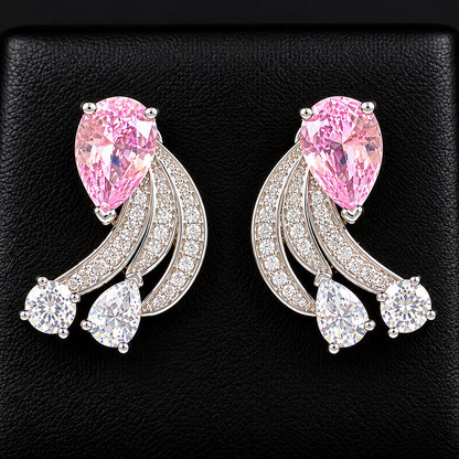 Pair of Angelique Wing Studs in silver-tone metal with sweeping zircon-lined curves and pear and round-cut stones.