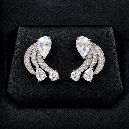 Pair of Angelique Wing Studs in silver-tone metal with sweeping zircon-lined curves and pear and round-cut stones.