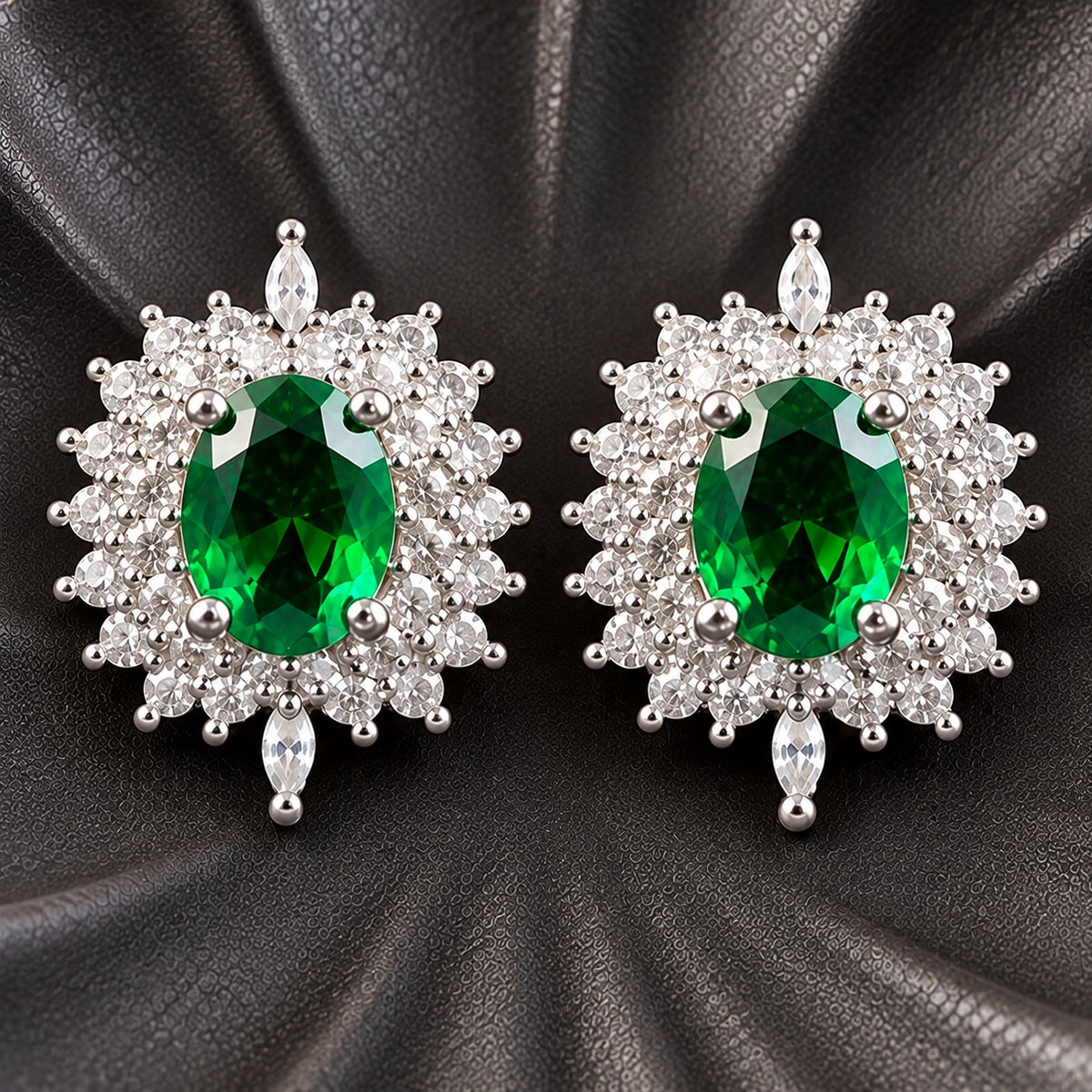 The Duchess Oval Studs with rich emerald green oval centre stones framed by clear zircon stones and marquise-cut accents