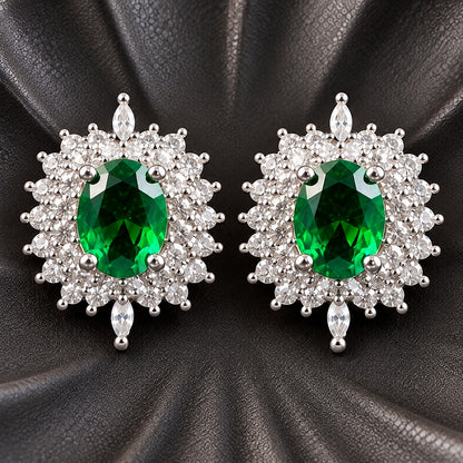 The Duchess Oval Studs with rich emerald green oval centre stones framed by clear zircon stones and marquise-cut accents